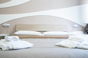 A bed or beds in a room at Terrazza Garibaldi