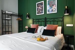 Posteľ alebo postele v izbe v ubytovaní Central Suites Barcelona