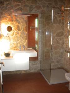 a bathroom with a sink and a shower at Pyrgos Luxury Country Home in Ialysos