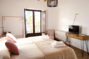 Postel nebo postele na pokoji v ubytování Hotel Rural El Cedro