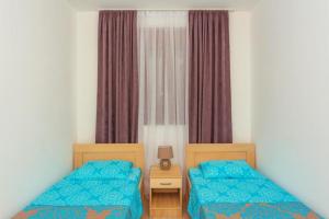 Postel nebo postele na pokoji v ubytování Engora 2