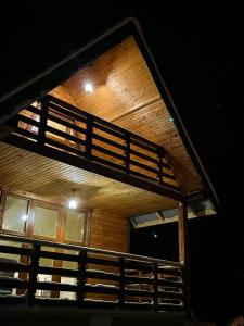 a view of a building with a balcony at Hill Hut in Myta +13 photos