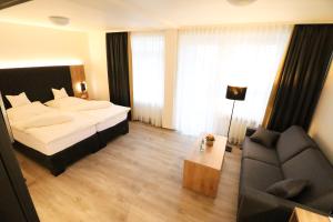 Postel nebo postele na pokoji v ubytování Hotel Wiehen-Therme