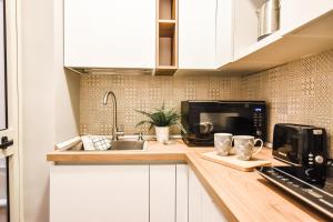 Kuchyň nebo kuchyňský kout v ubytování Cosy Albert's Seaside Suites (Sliema) + 37 fotografií