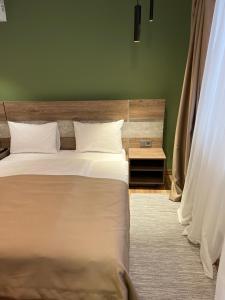 Postel nebo postele na pokoji v ubytování Loft wood