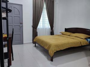 Voodi või voodid majutusasutuse Kayangan Inn toas