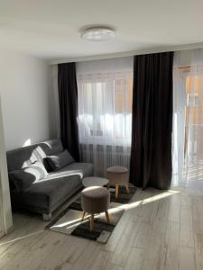a living room with a couch and a table at Holiday 88 in Leukerbad