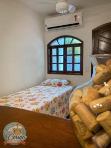 En eller flere senger på et rom på Casa da Coruja