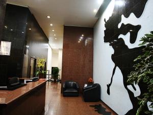 Uma TV ou centro de entretenimento em Cheverny Apart Hotel