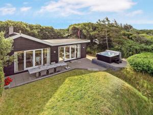 an aerial view of a house with a barbecue at 6 person holiday home in Vinderup-By Traum in Vinderup