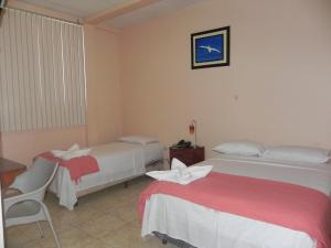 Postel nebo postele na pokoji v ubytování Hostal La Posada De Jose Carlos