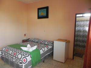 Postel nebo postele na pokoji v ubytování Hostal La Posada De Jose Carlos