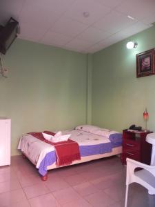 Postel nebo postele na pokoji v ubytování Hostal La Posada De Jose Carlos