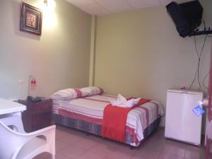 Postel nebo postele na pokoji v ubytování Hostal La Posada De Jose Carlos