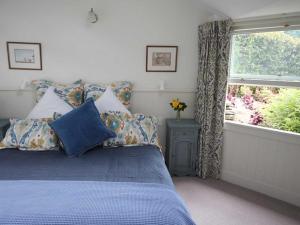 Ένα ή περισσότερα κρεβάτια σε δωμάτιο στο Arrowtown Lodge