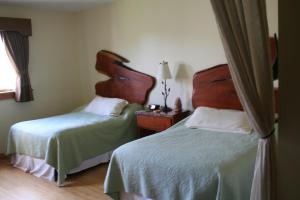 Postel nebo postele na pokoji v ubytování Hotel Floyd