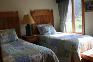 Postel nebo postele na pokoji v ubytování Hotel Floyd