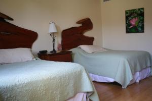 Postel nebo postele na pokoji v ubytování Hotel Floyd