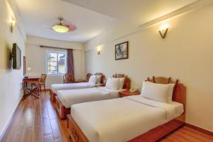 Postel nebo postele na pokoji v ubytování Khách sạn Park Hotel Dalat + 37 fotografií