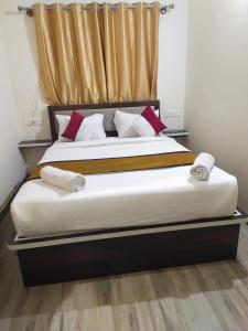 Postel nebo postele na pokoji v ubytování SM Rooms HSR Layout Bengaluru