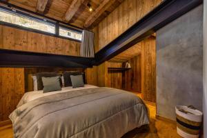 Voodi või voodid majutusasutuse La Ferme à Roland ski in - ski out - Happy Rentals toas