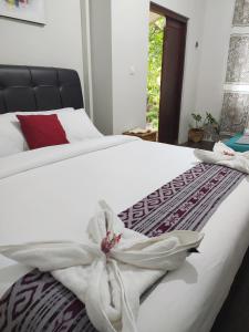 Cama o camas de una habitación en Bata Merah Homestay