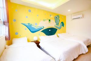 Ein Bett oder Betten in einem Zimmer der Unterkunft Mermaid B&B