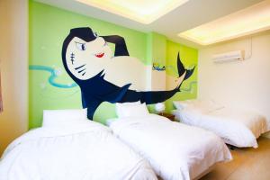 Ein Bett oder Betten in einem Zimmer der Unterkunft Mermaid B&B