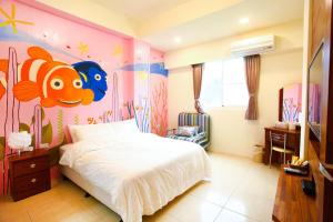 Ein Bett oder Betten in einem Zimmer der Unterkunft Mermaid B&B