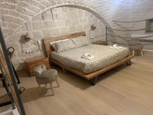 Postel nebo postele na pokoji v ubytování Le Vecchie Mura suite & room