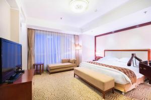 Postel nebo postele na pokoji v ubytování Inner Mongolia Grand Hotel