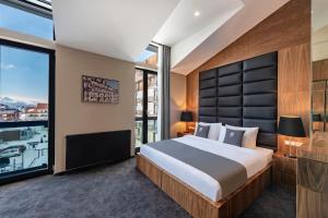Ένα ή περισσότερα κρεβάτια σε δωμάτιο στο Bristol Hotel and Spa Bakuriani