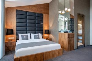Ένα ή περισσότερα κρεβάτια σε δωμάτιο στο Bristol Hotel and Spa Bakuriani