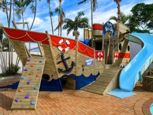 a childrens playground with a slide and a slidesktop at Sea n Sky in Uvongo Beach