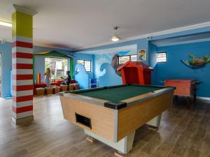 a billiard room with a pool table in it at Sea n Sky in Uvongo Beach