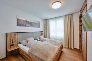 Posteľ alebo postele v izbe v ubytovaní 1400 FlexenLodge