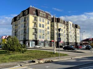 a large building on the side of a street at "Имеретинские курорты", апартаментный комплекс in Adler