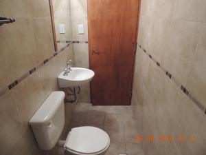 Ванная комната в Departamentos Urquiza +25 фотографий