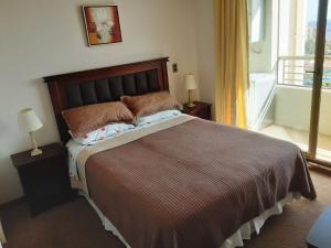 Postel nebo postele na pokoji v ubytování Departamento Atlántico Viña Del Mar + 24 fotografií
