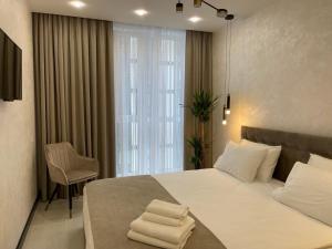 Кровать или кровати в номере Apartments VIP AVALON