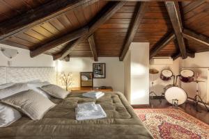 a bedroom with a large bed and wooden ceilings at Xigia Escape villas in Khartáta