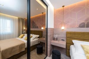 Postel nebo postele na pokoji v ubytování Green Sky Luxury Penthouse Apartment