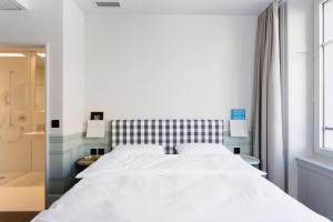 Ένα ή περισσότερα κρεβάτια σε δωμάτιο στο Boutique & Art Hotel Helvetia