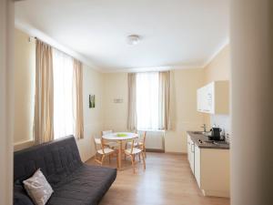 a living room with a couch and a table at Villa Sonnenschein in Laa an der Thaya