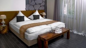 
Ein Bett oder Betten in einem Zimmer der Unterkunft Hotel Koch Schilt
