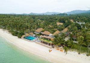 an aerial view of a resort on the beach at Mimosa Resort & Spa in Mae Nam