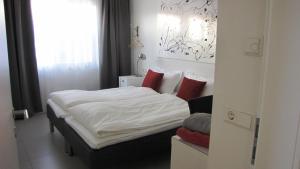 Voodi või voodid majutusasutuse Halllandsnes Apartments toas