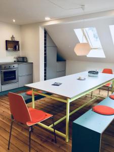 a kitchen with a table and chairs in a room at Rosinas - Fräulein Winkler in Oberstaufen