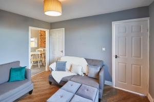 a living room with two couches and a couch at Host & Stay - Woods Yard in Skelton