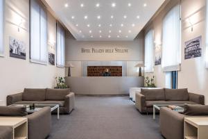 a lobby with couches and a waiting room at Hotel Palazzo Delle Stelline in Milan